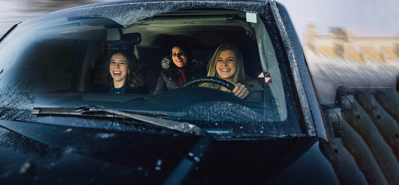Group of women driving through the snow